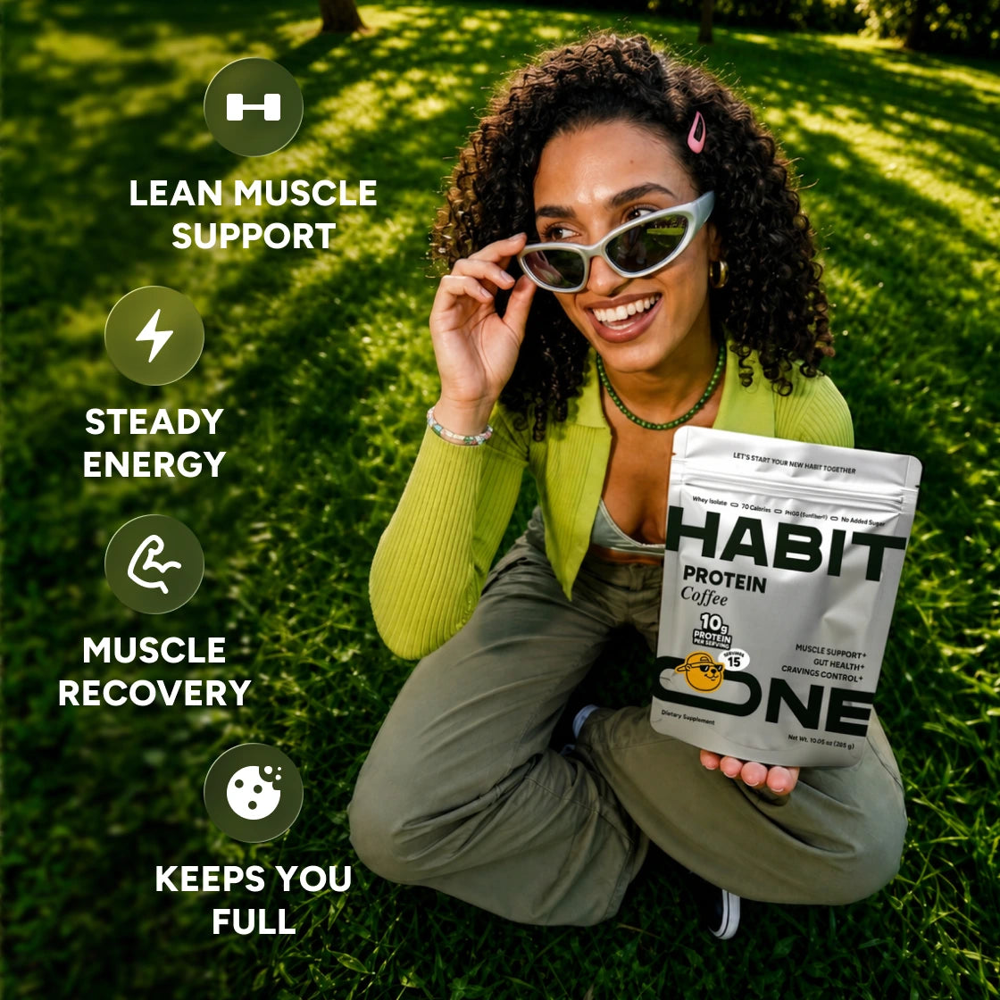 Smiling woman in sunglasses sitting on the grass with a Protein Coffee bag. Labels: lean muscle support, steady energy, muscle recovery, keeps you full