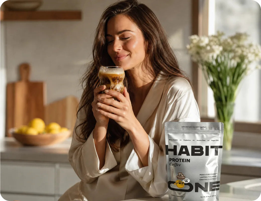 Woman enjoying HabitONE protein coffee