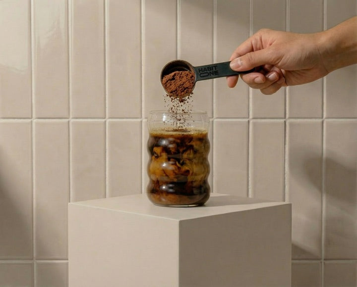 Scooping HabitONE into a glass