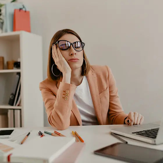 Woman feeling foggy and tired at work