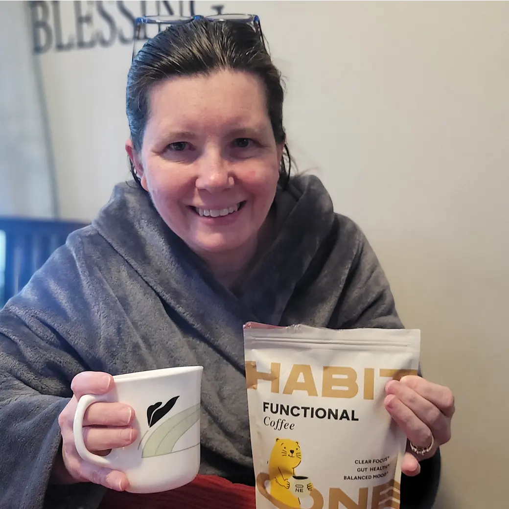 Woman drinking HabitONE functional coffee