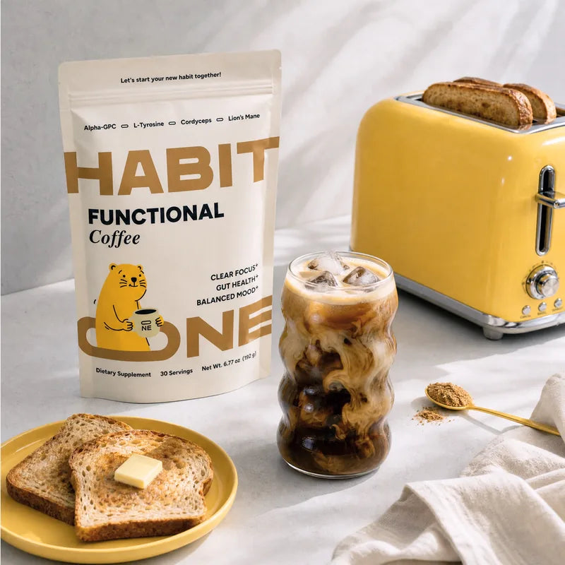 HabitONE Functional Coffee poured over ice, with buttered toast and a scoop of the blend